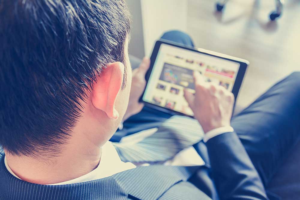 Businessman on tablet